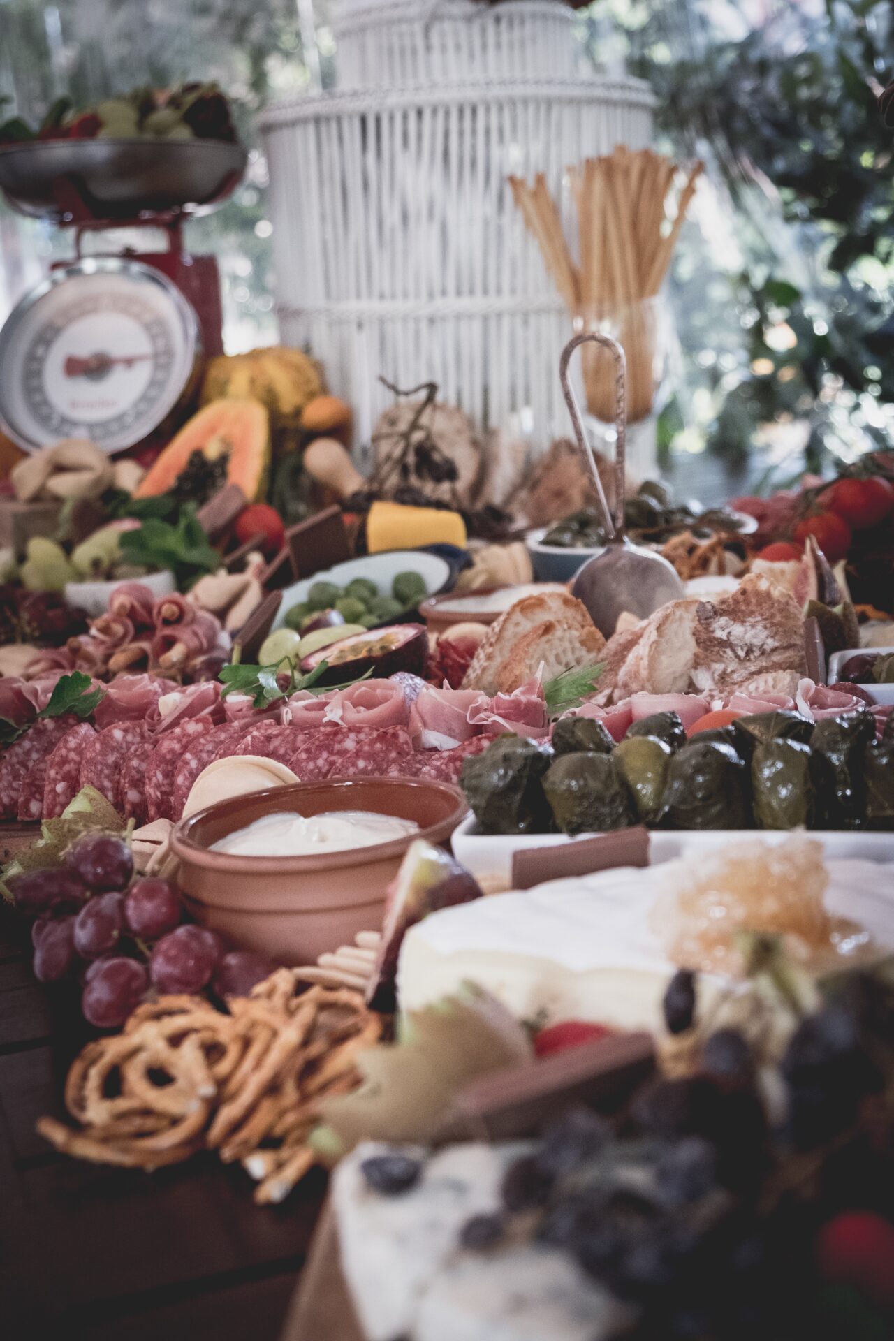 pretzels, grapes, wheat bread, and salami sausages platter